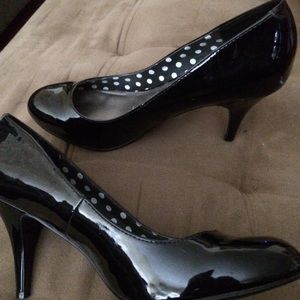 Patent leather pumps.